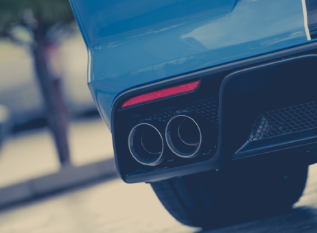 Cropped image of a cars exhaust pipes