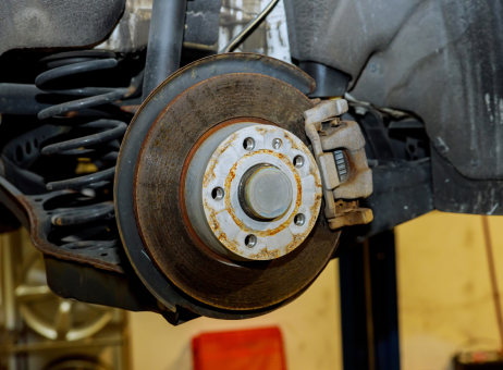 Suspension and brake disk of a car